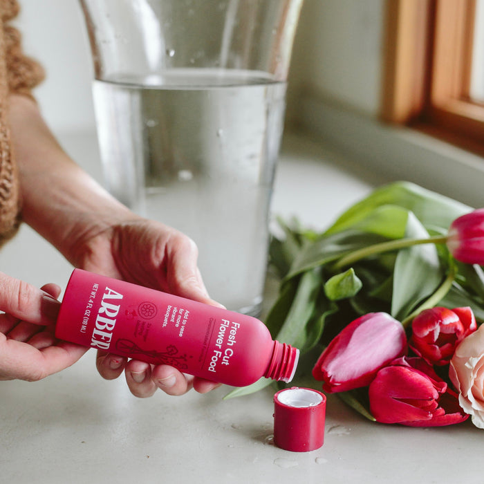 Pouring cut flower food